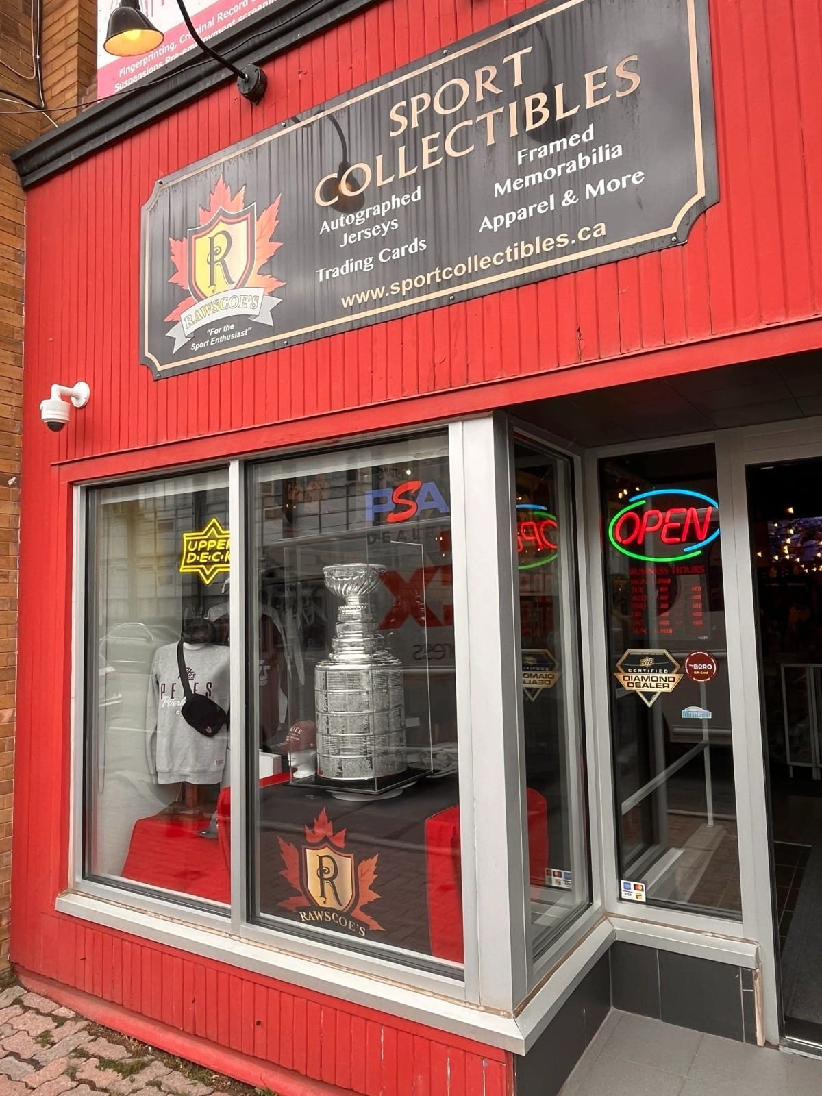 Sports collectibles storefront with tinted display glass